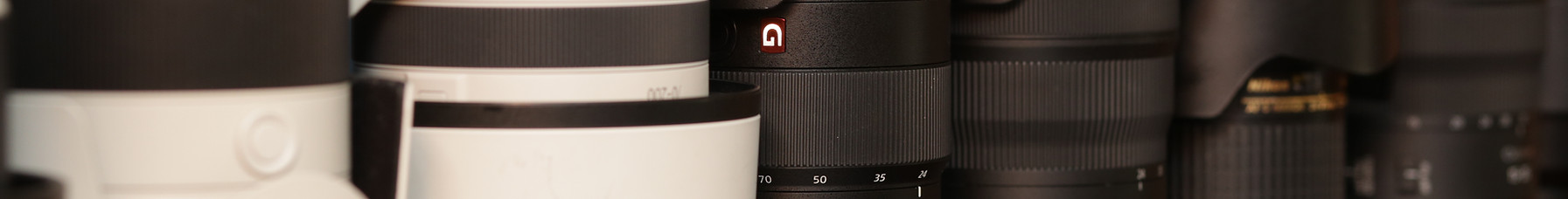 Text over image of camera lenses. "Camera and lens rentals. rental inventory subject to change. first comes, first serve."