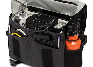 Black camera bag full of camera gear and equipment theshutterbug