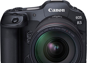 Black Canon EOS R3 camera with lens capturing light, theshutterbug.