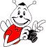 The Shutterbug cartoon holding a camera, pointing, wearing red shirt, the shutterbug logo.