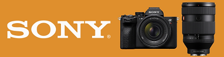 Sony camera and lens on orange background, theshutterbug